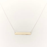 silver bar necklace on a white background
