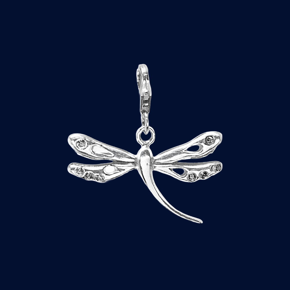Silver dragonfly pendant on a dark blue background