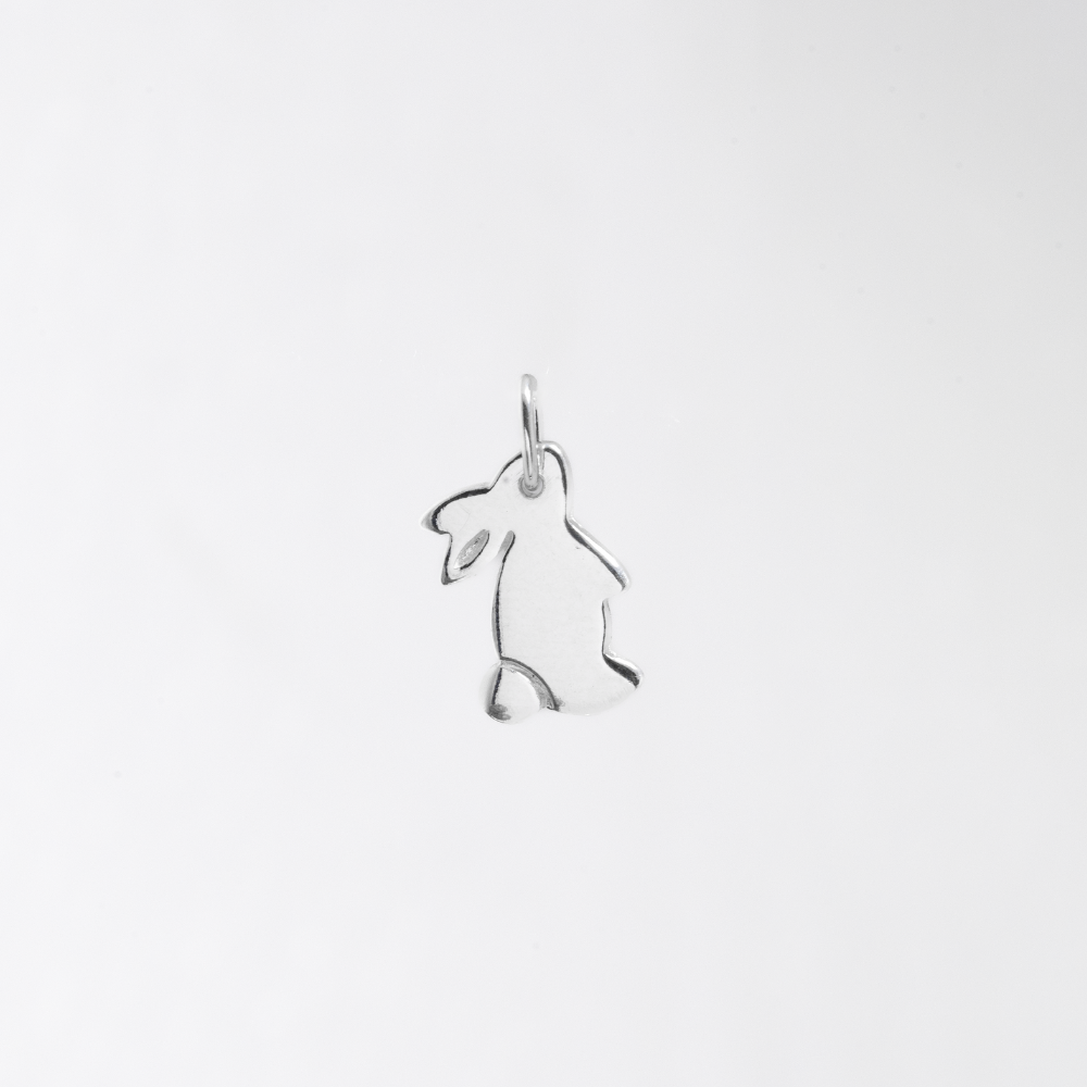 Silver rabbit pendant on a white background