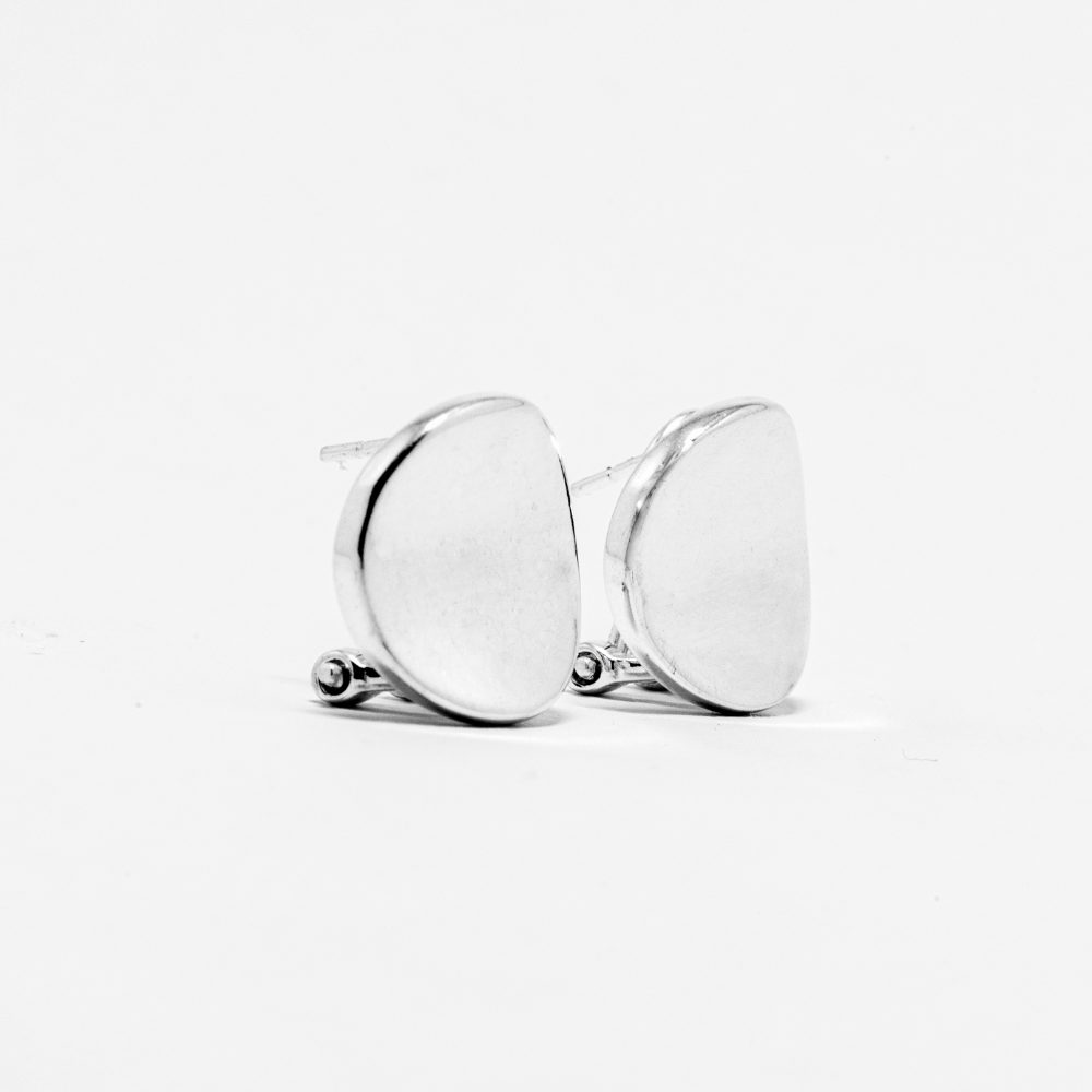 Pair of silver earrings on a light gray background