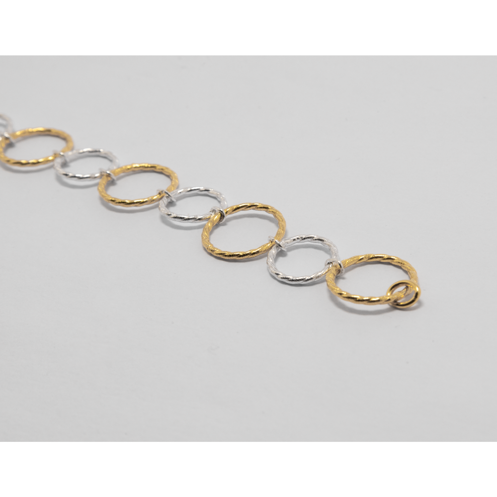 Gold and silver chain on a light background