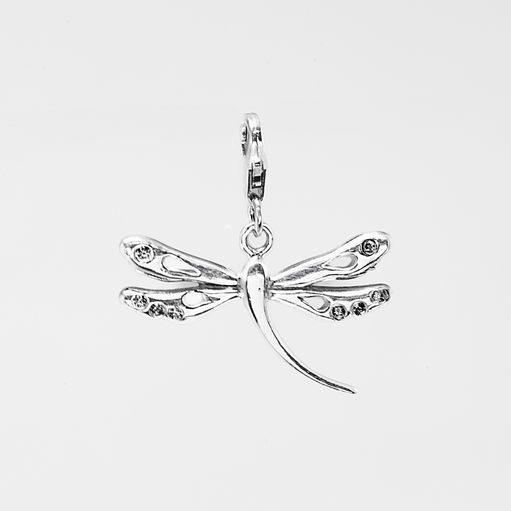 Silver dragonfly pendant on a light gray background