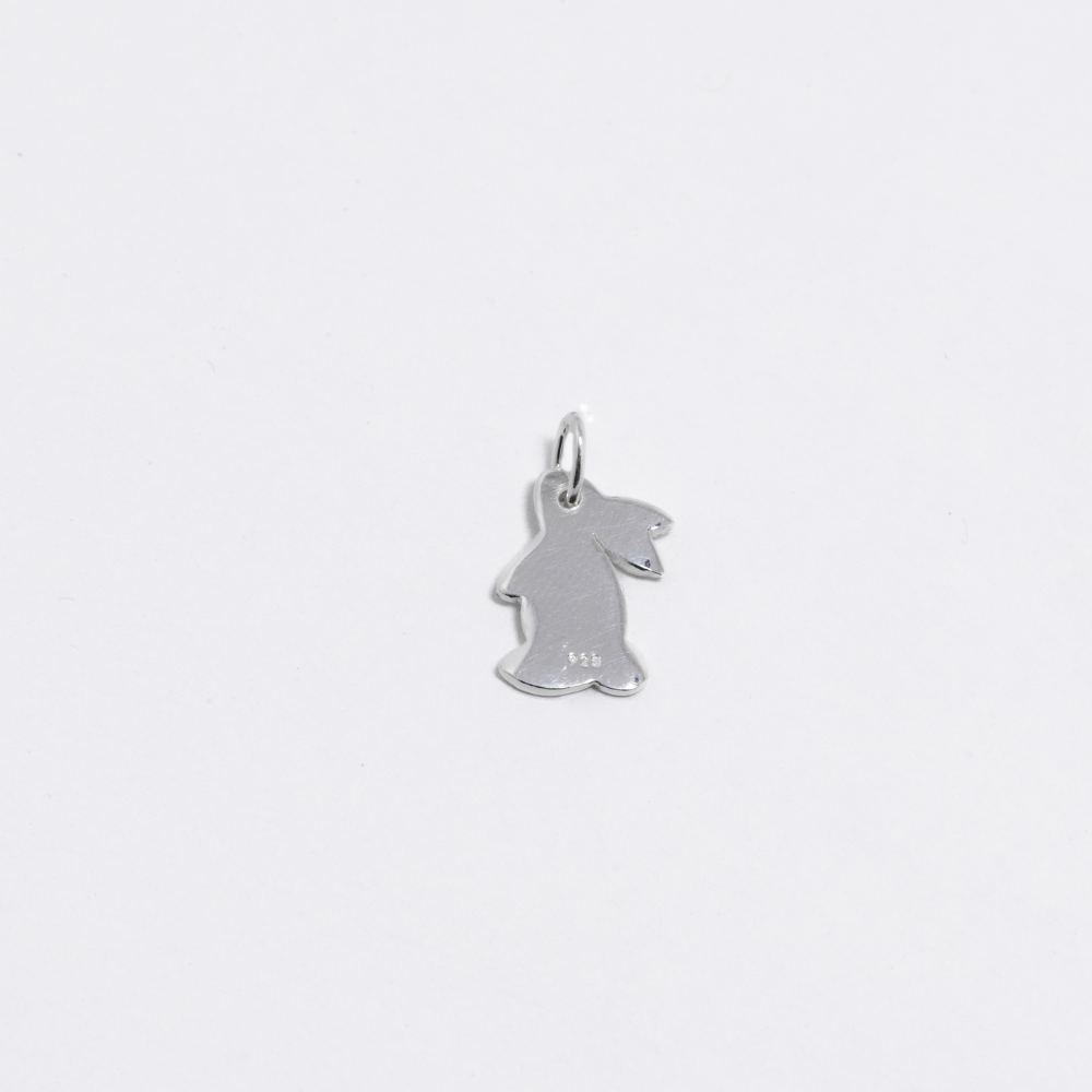 Silver bunny-shaped pendant on a light grey background