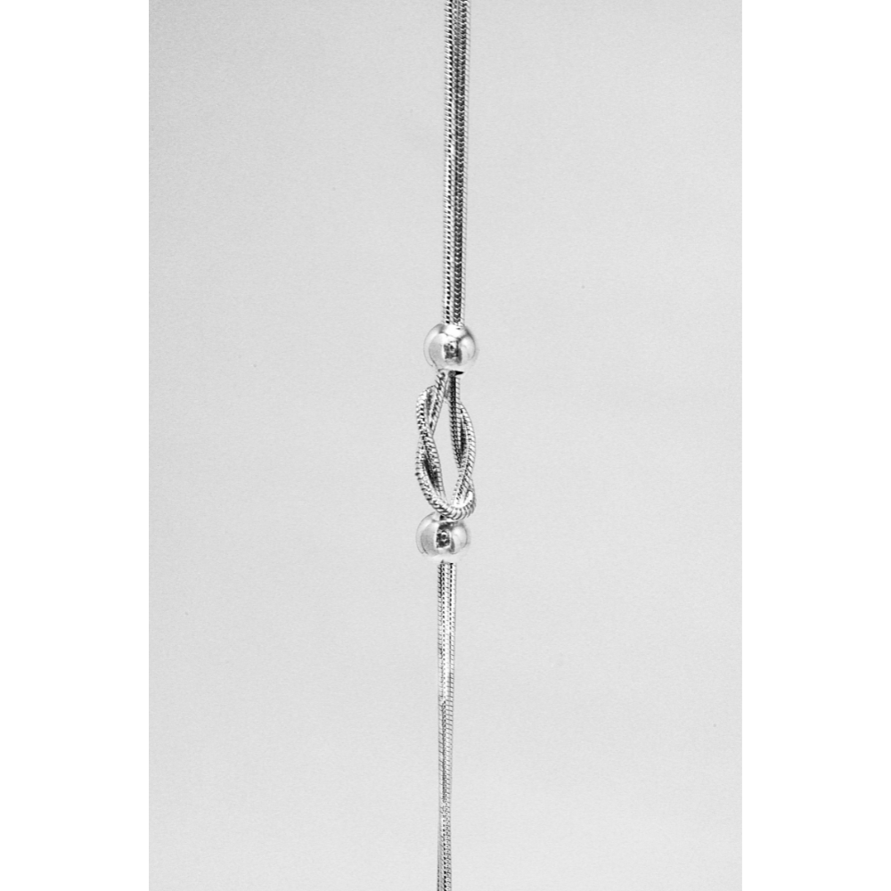 Silver bracelet with a twisted knot and beads