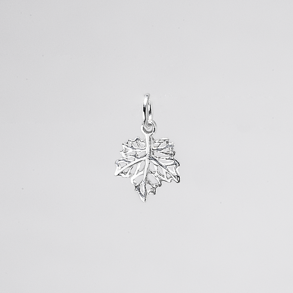 Silver leaf-shaped pendant on a light gray background