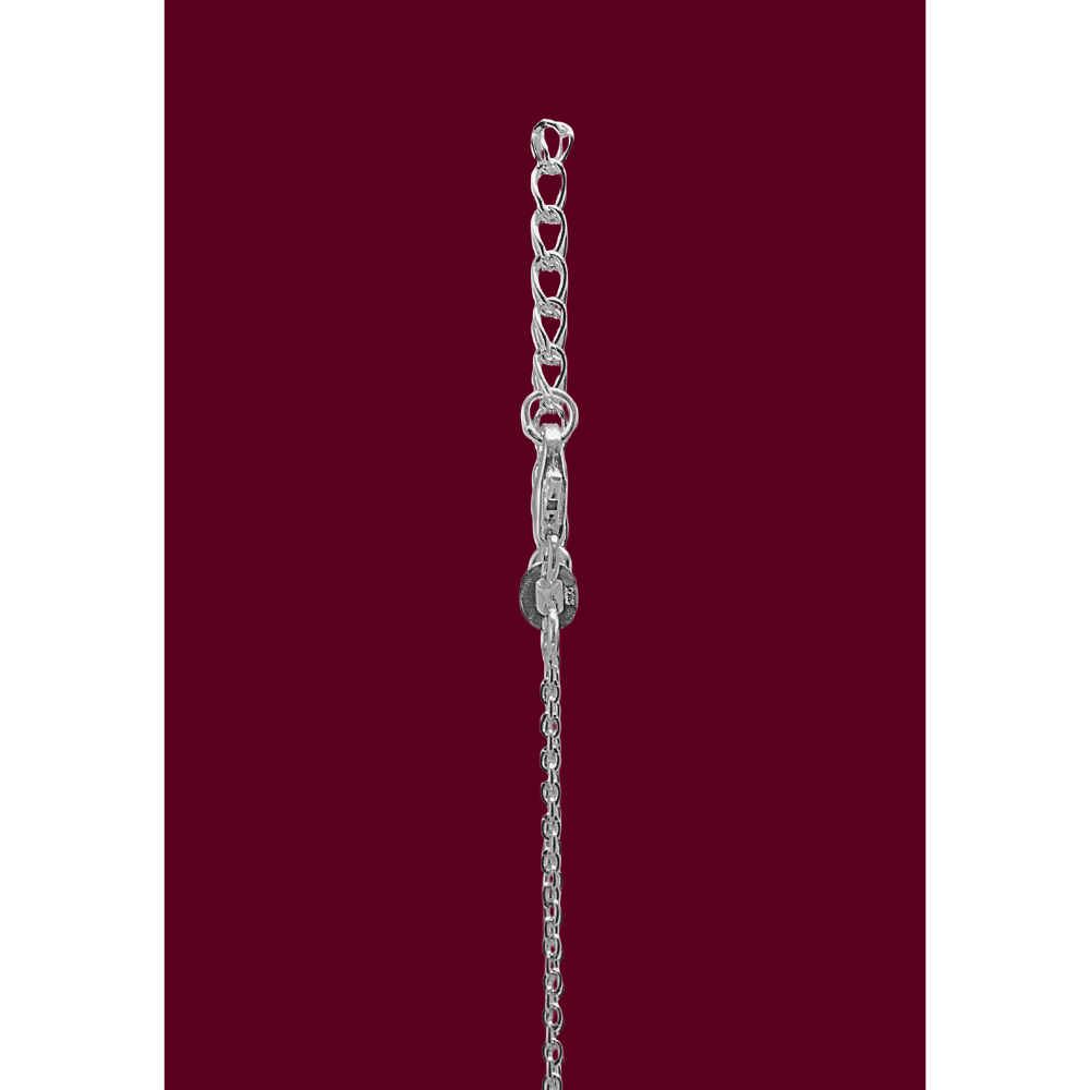 Silver chain bracelet on a red background