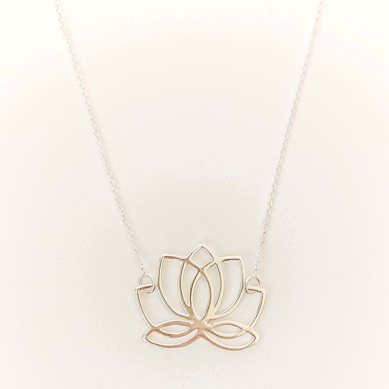 lotus flower necklace on a white background