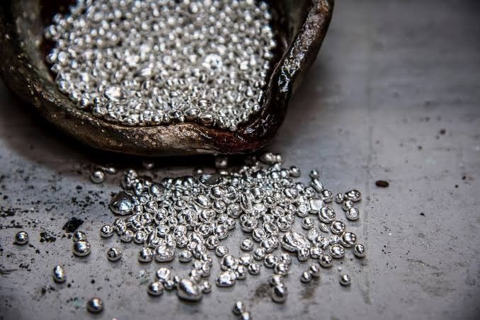 Silver beads in a vessel