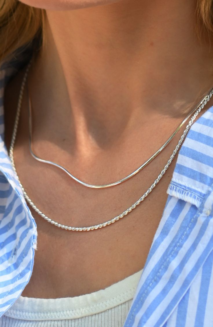 Layered silver chains on model 