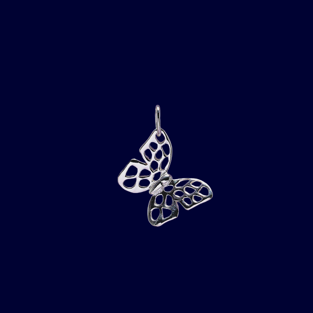 Silver butterfly pendant on a dark blue background