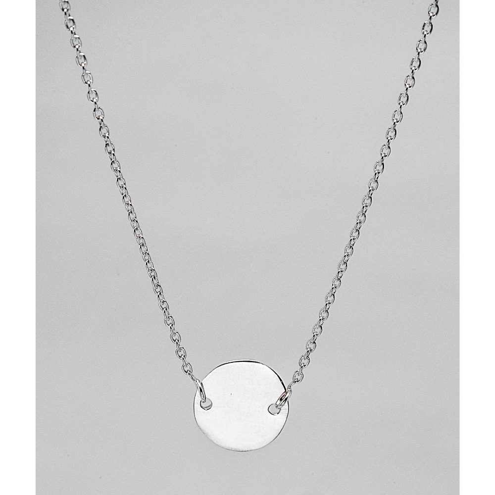 Silver necklace with a round pendant on a grey background