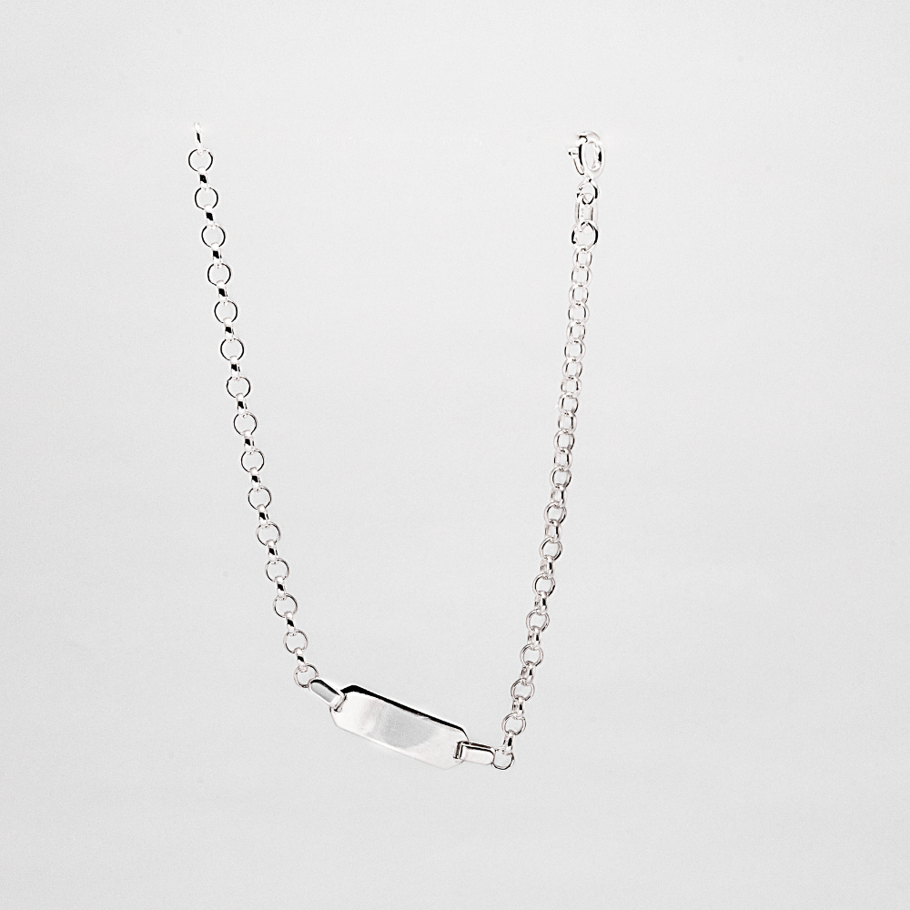 Silver bar bracelet on a light gray background