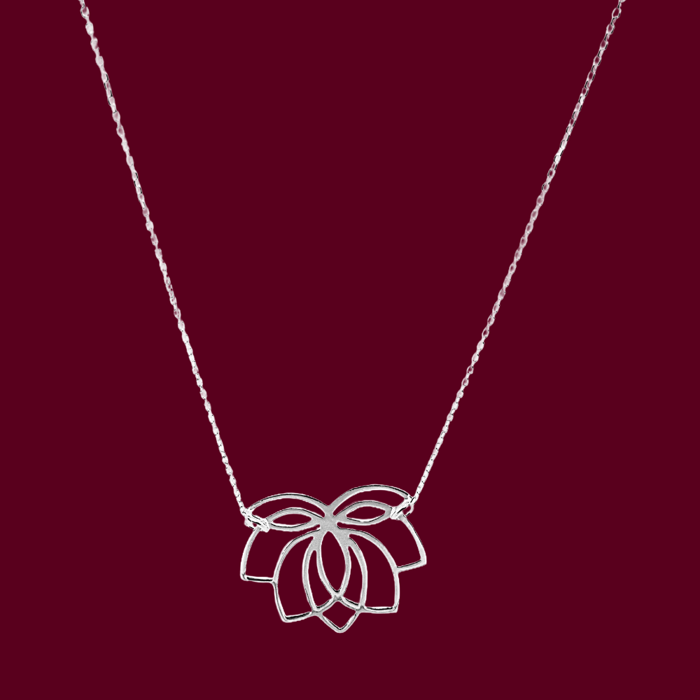Silver necklace with a lotus flower pendant on a red background