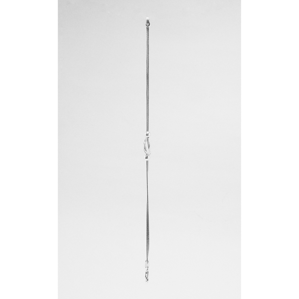 Tall, thin silver bracelet on a white background