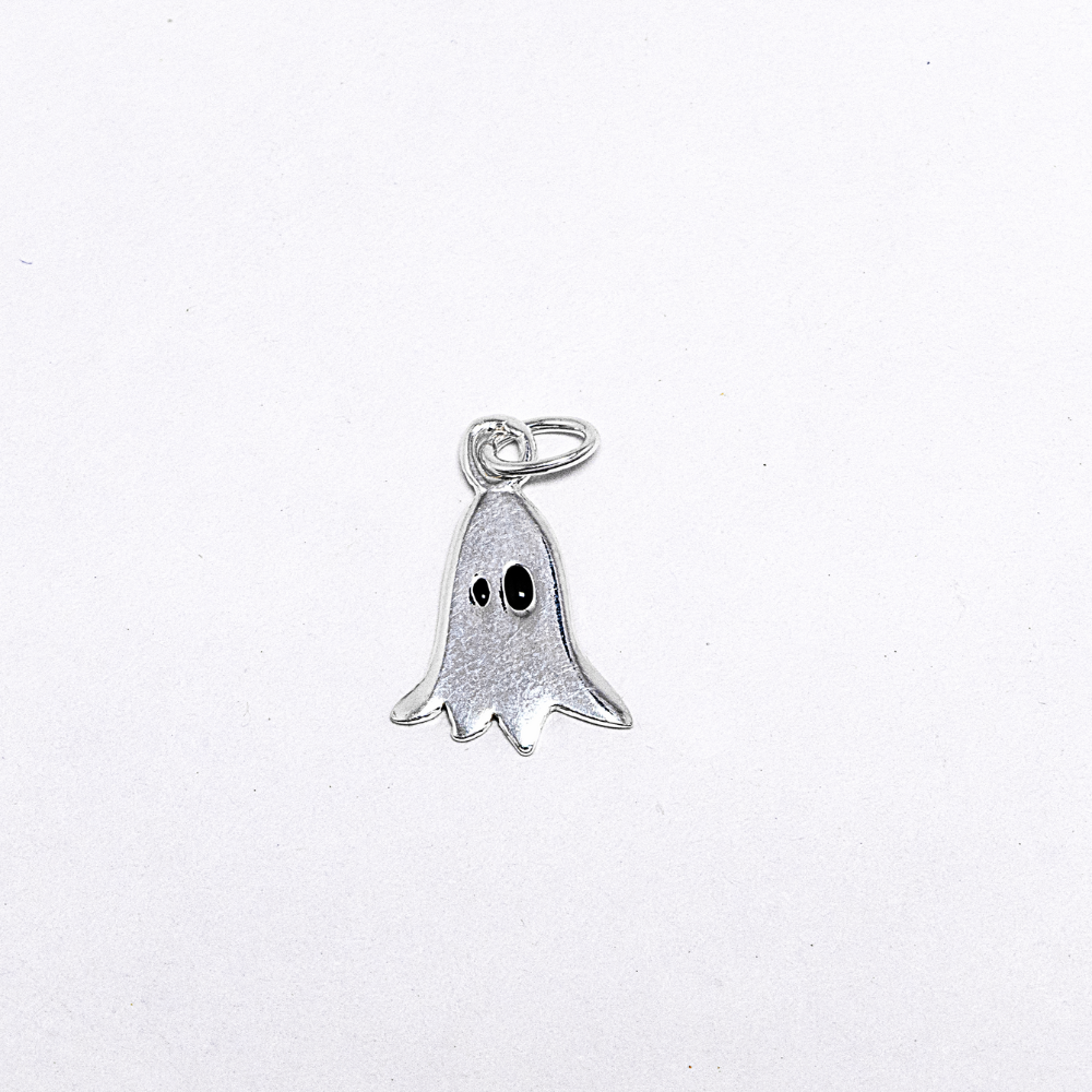Silver ghost charm on a white background