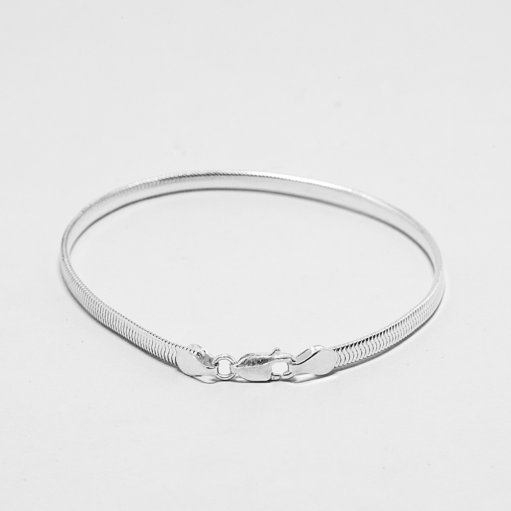 textured pure silver bracelet on a light background