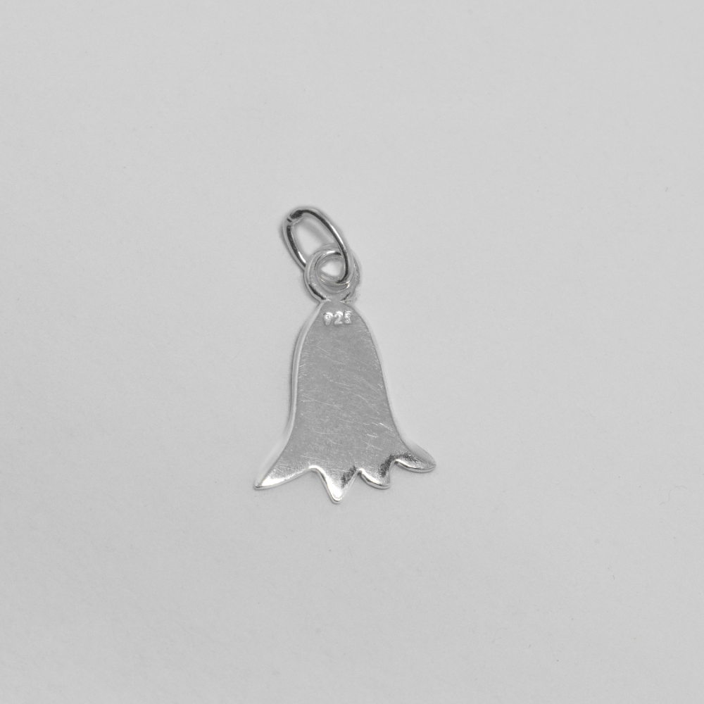 Silver bell-shaped pendant on a light grey background
