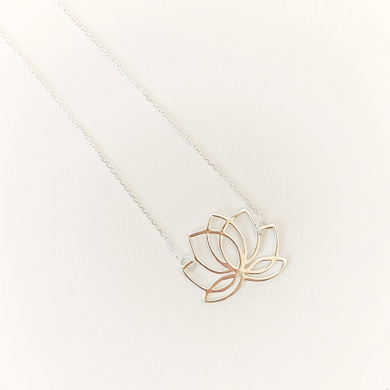  lotus flower necklace on a white background