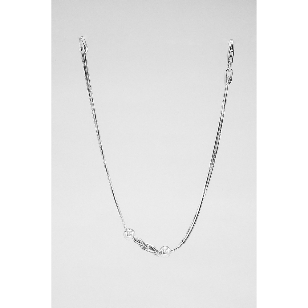 Silver bead bracelet on a light grey background