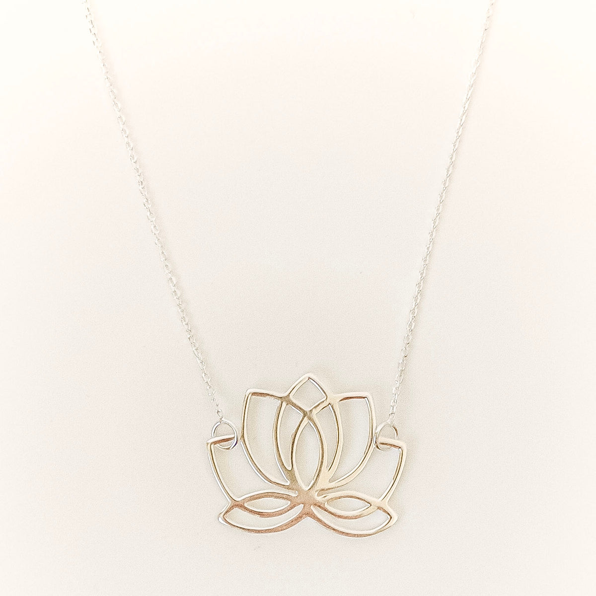 lotus flower necklace on a white background